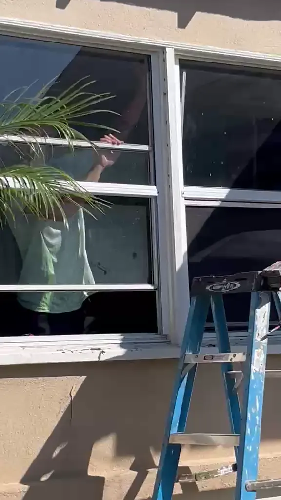 LB Handyman On Demand installing new windows on a Long Beach home